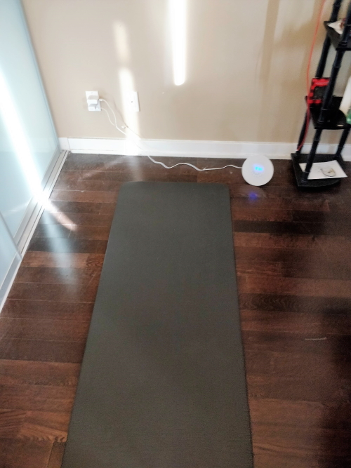 Minimalist yoga mat sleeping in small condo